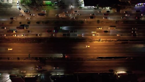 Aerial Night View of Heavy Traffic Flow with Blurred Light Trails