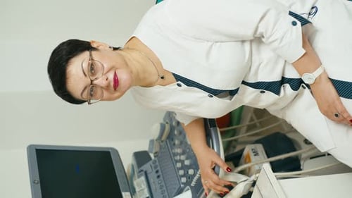 Female Doctor with Ultrasound Machine in Hospital