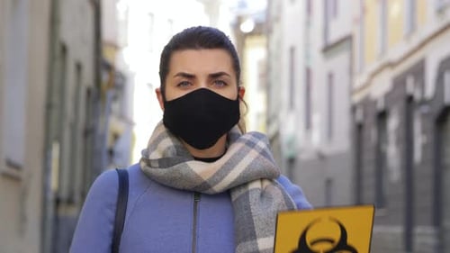 Young woman in tallinn estonia wearing biohazard mask for pandemic safety