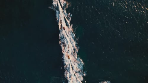 Jet Skis Speeding Across the Ocean, Aerial View