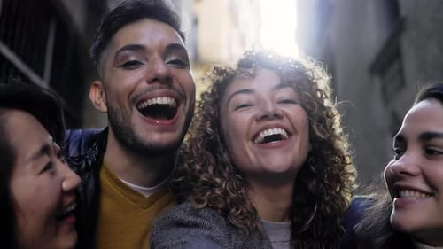 Diverse Friends Laughing Together on City Street