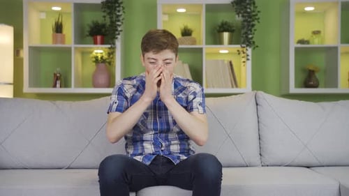 Man Reacting to Sports Game on the Couch