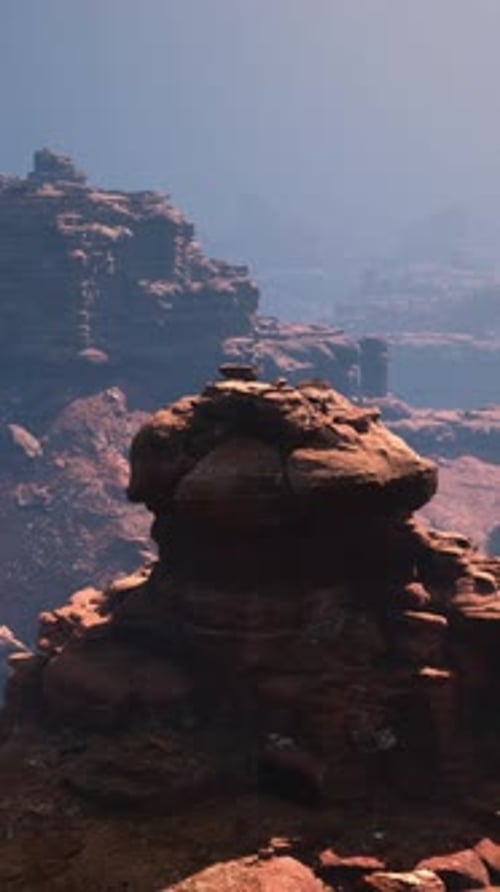 A Majestic Red Stone Canyon Embracing an Enigmatic Rock Formation