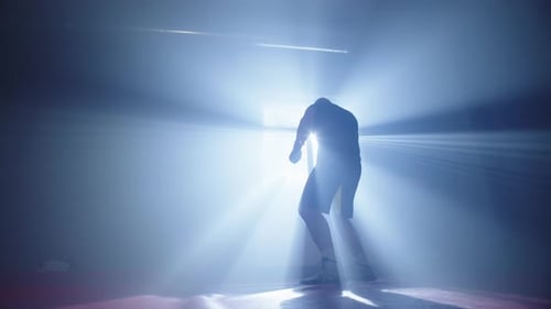 Silhouette of a Boxing Man in the Hall