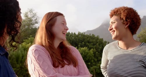 Smiling Friends Laughing Outdoors Together