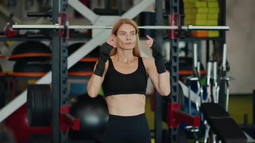 Fit Woman Stretching in Gym Before Workout