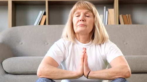 Close Up of an Elderly Woman Doing Yoga Exercises at Home Yoga Training for Seniors Yoga Concept