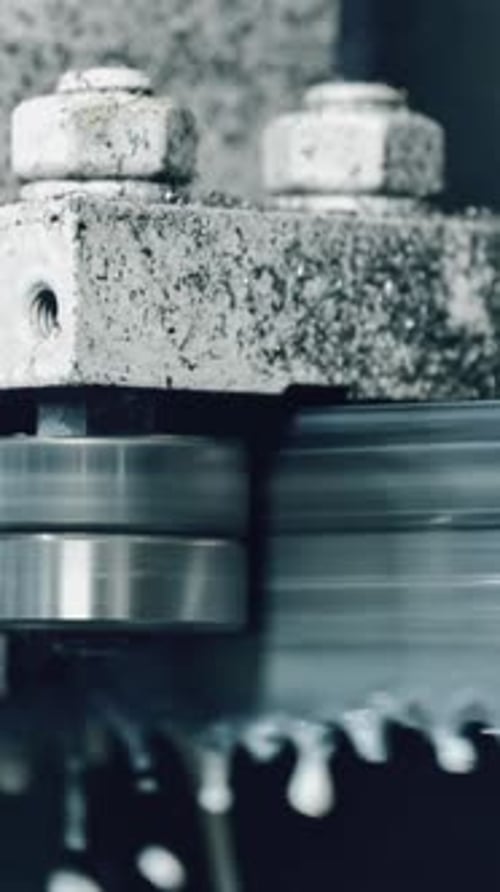 Metal cutting bandsaw in industrial workshop setting