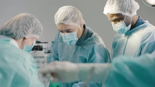 Surgical Team Performs Operation in Operating Room