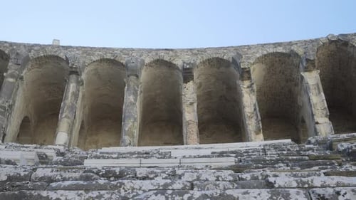 The Camera Moves Along the Steps of the Seats of the Ancient Amphitheater