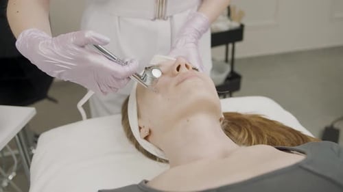 Woman Receives Facial Treatment at Medi Spa