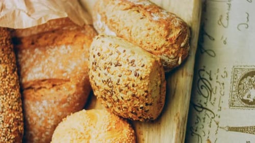 Fresh Seeded Bread Loaves on Cutting Board