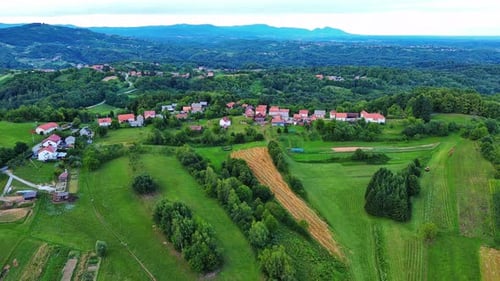 Valley with Fields Meadows Agricultural Farms Forests and Houses
