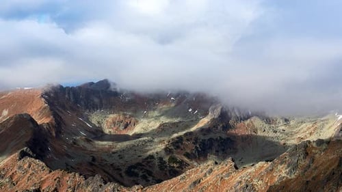 Clouds Pass Over the Mountain Ridge