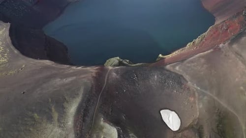 Aerial top down shot inside Ljotipollur Crater with volcanic lake in Iceland