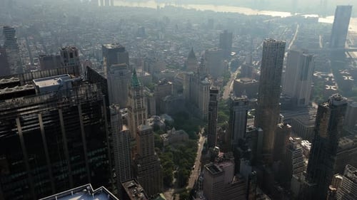 Aerial View of Manhattan New York City Showcasing Iconic Buildings and the Brooklyn Bridge Under a