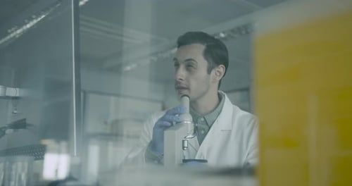 Man Using Microscope in Lab, Science and Research