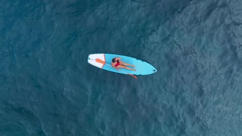 Aerial View Paddleboarding in a Gorgeous Mediterranean Lagoon With Clear Water