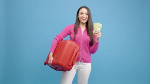 Young Woman Ready to Travel With Money