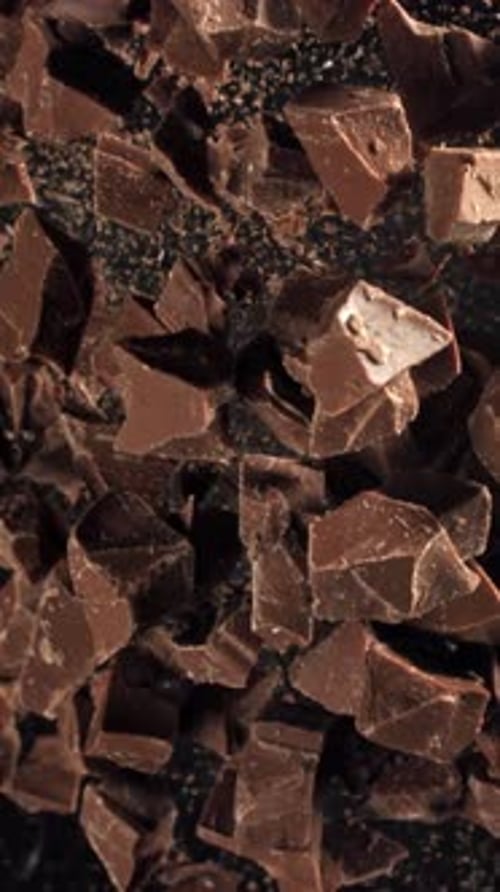 Pieces of Chocolate Fly Up and Fall Down Filmed on a Highspeed Camera at 1000 Fps