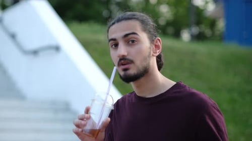 Close Up Portrait of Handsome Arab Man Walking in the Park