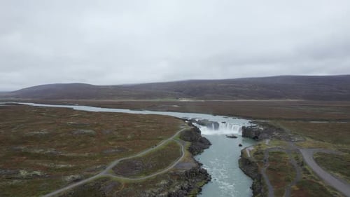 Majestic Aerial View of Godafoss Waterfall and Vast Icelandic Tundra