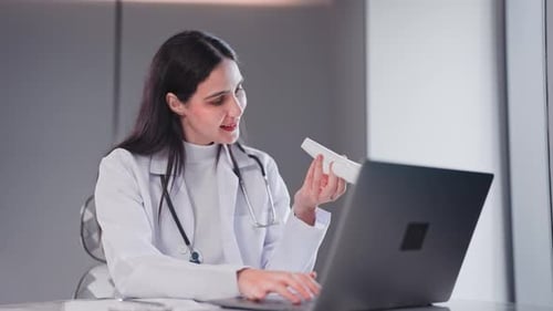 Female doctor explaining uterus anatomy via laptop