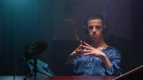 Stylish Broadcaster in Podcast Studio