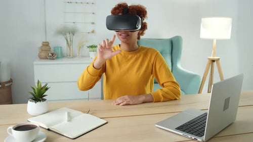 Woman Experiencing Virtual Reality Headset Indoors