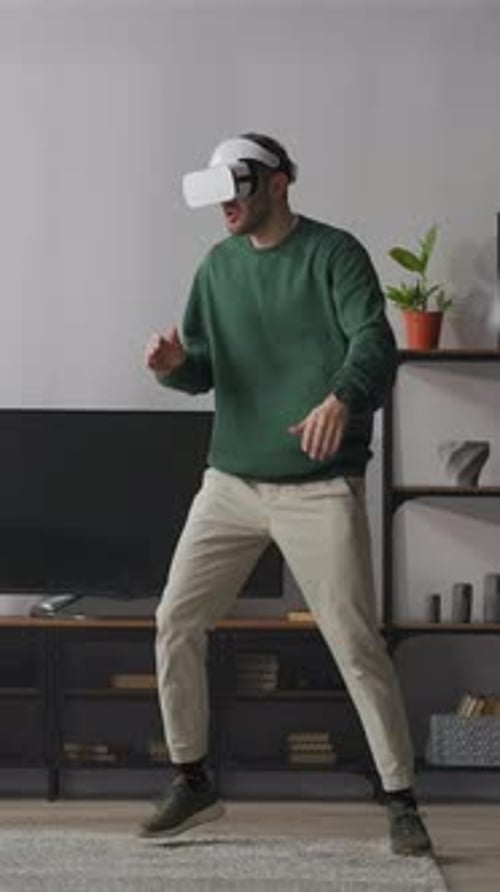 Man Wearing VR Headset Playing at Home