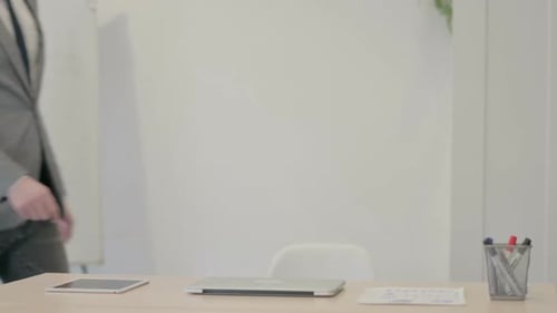 Young Businessman Coming Back to Office for Work