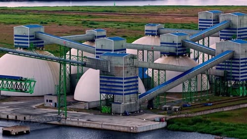 Aerial Parallax Shot of the Riga Fertilizer Terminal and its Dome Storage Tanks