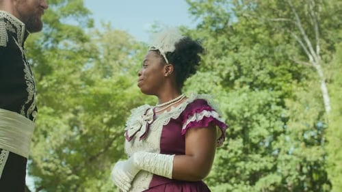 Aristocratic Woman Talking with Officer Outdoors in Park