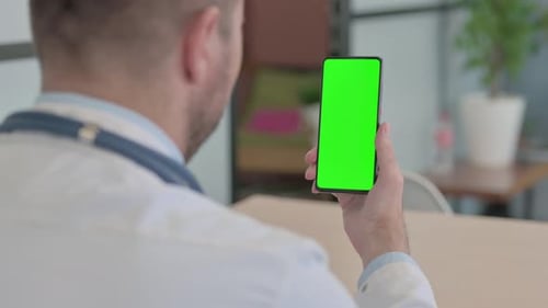 Doctor Using Smartphone with Chroma Key Green Screen