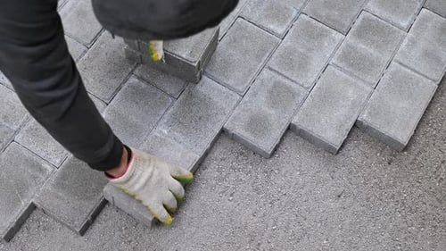 Paver Blocks Installation with Rubber Mallet