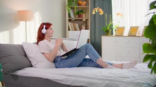 Woman Working from Home on Laptop