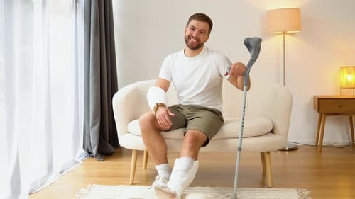 Man with Cast Giving Thumbs Up Indoors
