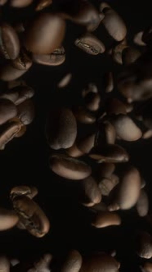 Coffee Beans Over Black Background. Close-up of coffee seeds. Super Slow Motion. 3d animation, 4K