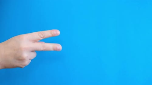 Hand Counting From One To Five On Blue