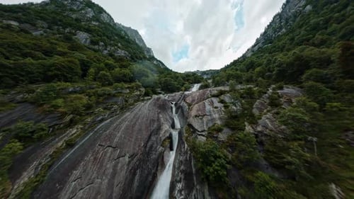 Aerial View of Waterfall Cascading Down Mountainside