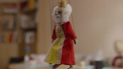 A Beautiful and Charming Vintage Puppet Figure On Display in a Warm Cozy Interior Setting