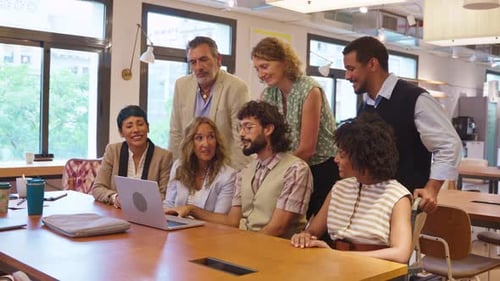 Business Team Discussing Project on Laptop in Modern Office Meeting