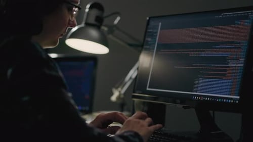 It Specialist Girl Works Sits At A Laptop Computer Monitor Writes Artificial Intelligence Code While