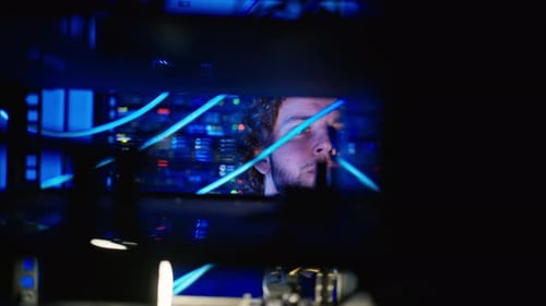 Man analysing servers in a data center