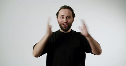 Surprised Man Reacts With Amazement and Wonder in Studio