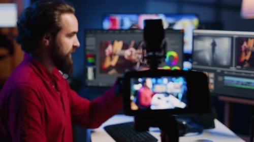 Male Content Creator Vlogging in Editing Studio