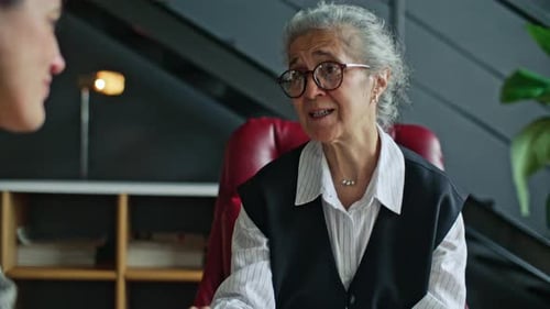 Senior Woman Talking with a Young Adult