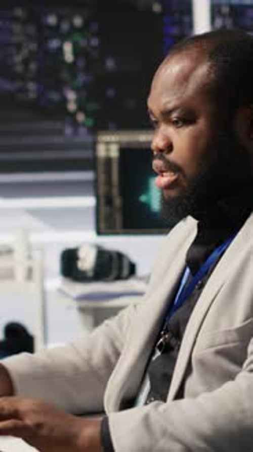 Vertical Video Stressed Technician in Data Center Managing AI Servers Drinking Coffee