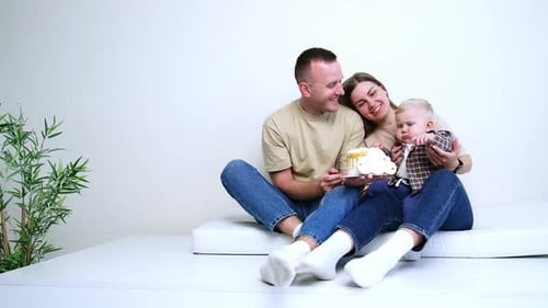Happy Family Celebrates Infant's Birthday