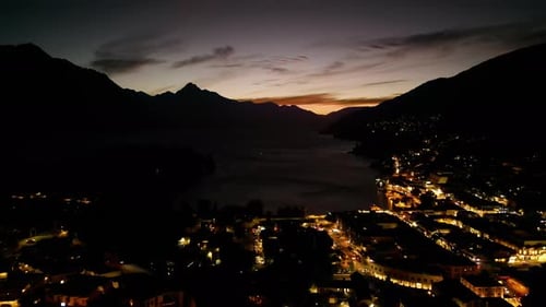 Queenstown during the night drone shot. beautiful city night lights shining in the dark. mountains s